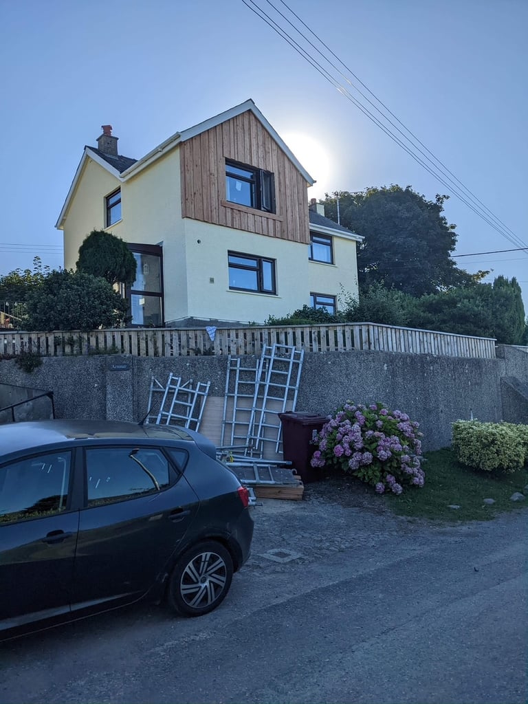 a house with the top half clad in wood