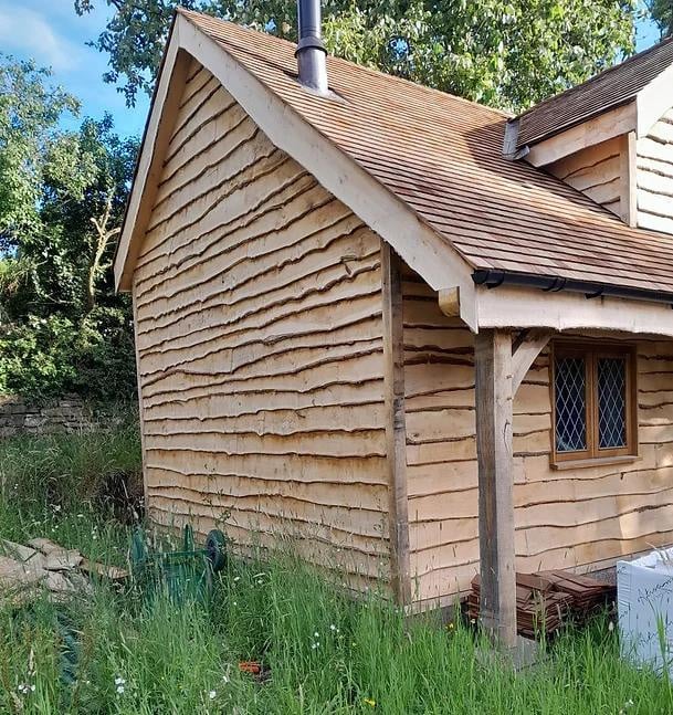 a waney edge wooden clad house